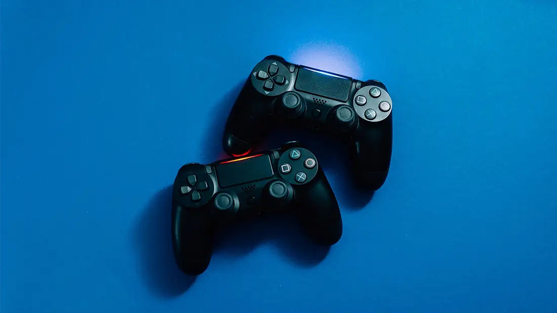 video game controllers on a a blue background